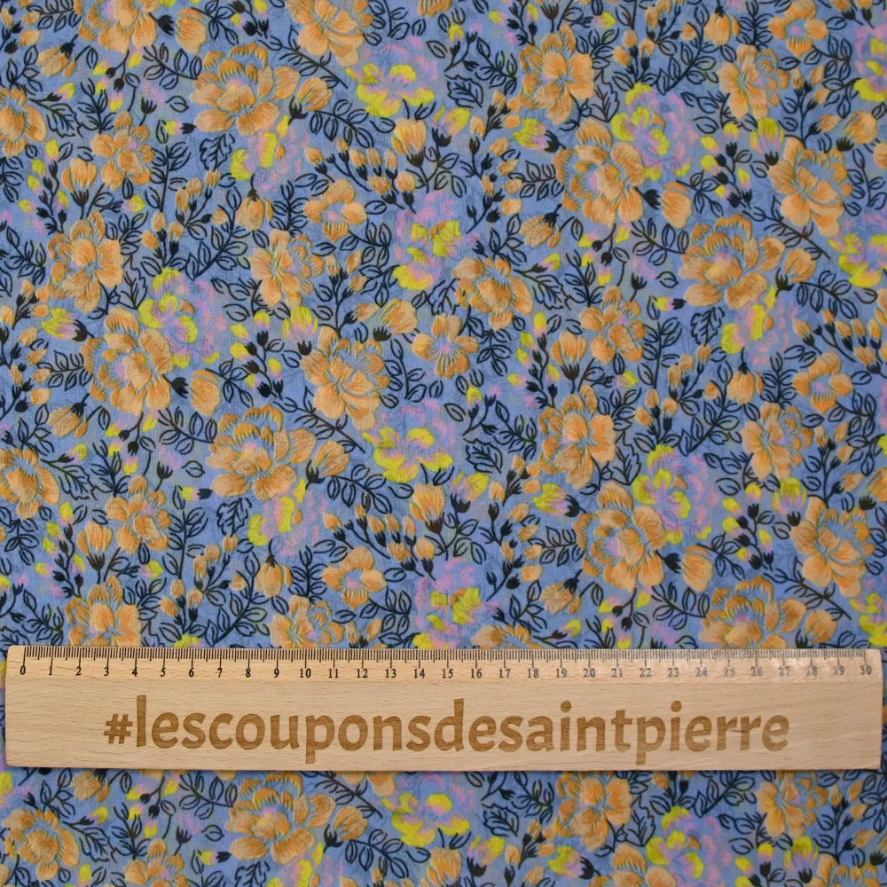 Mousseline imprimée fleurs orange fond bleu barbeau